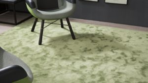 salón con alfombra magnifik de kp alfombras a medida en color verde con silla encima