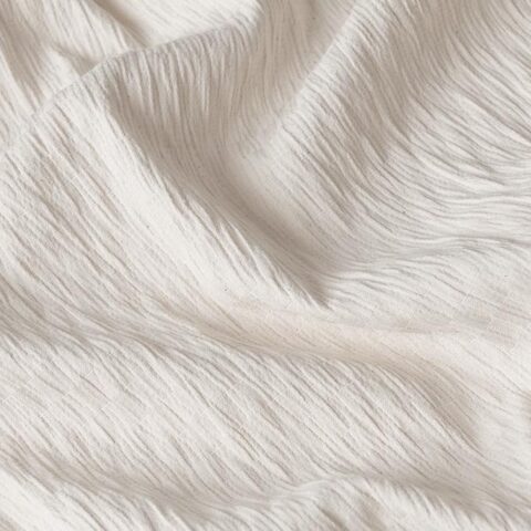 Detalle diseño cuadros tejido algodón y elastano de funda colchón Velfont Niza, elástica y adaptable a largos.