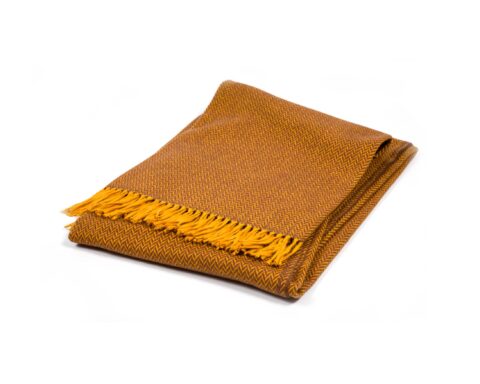 Manta Ezcaray lana merino 100% Australia extra fino diseño en forma de espiga comprar online Fernández Textil. Color naranja